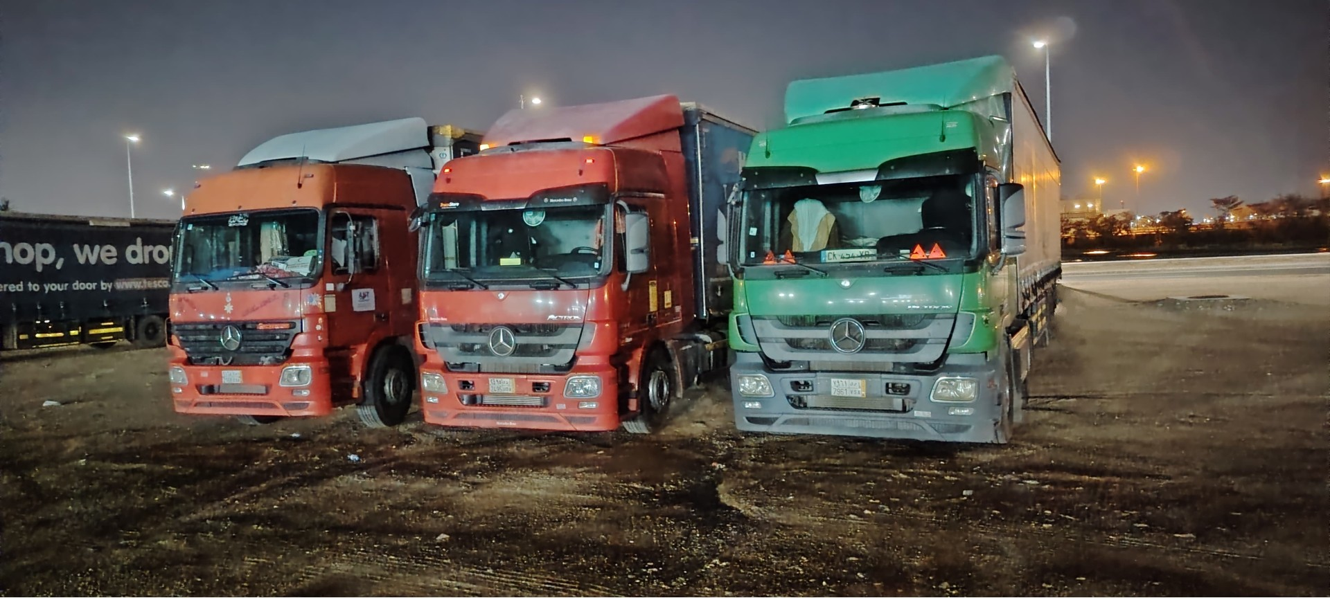 Cinematic shot of an oversized load on a multi-axle truck at sunrise